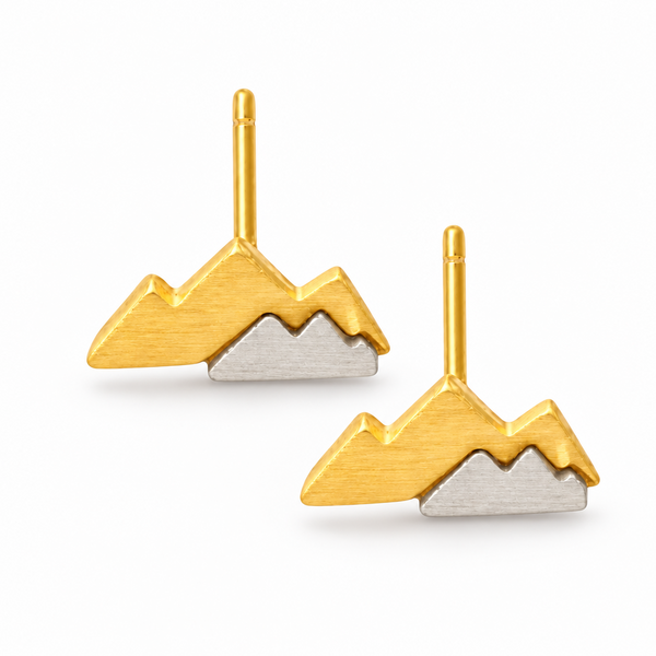 the beehive two-tone gold and silver mountain stud earrings with a layered brass design shown next to a ruler